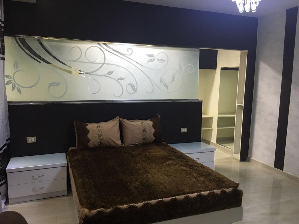 At Milsa Nasr City, Building No. 21 Cairo